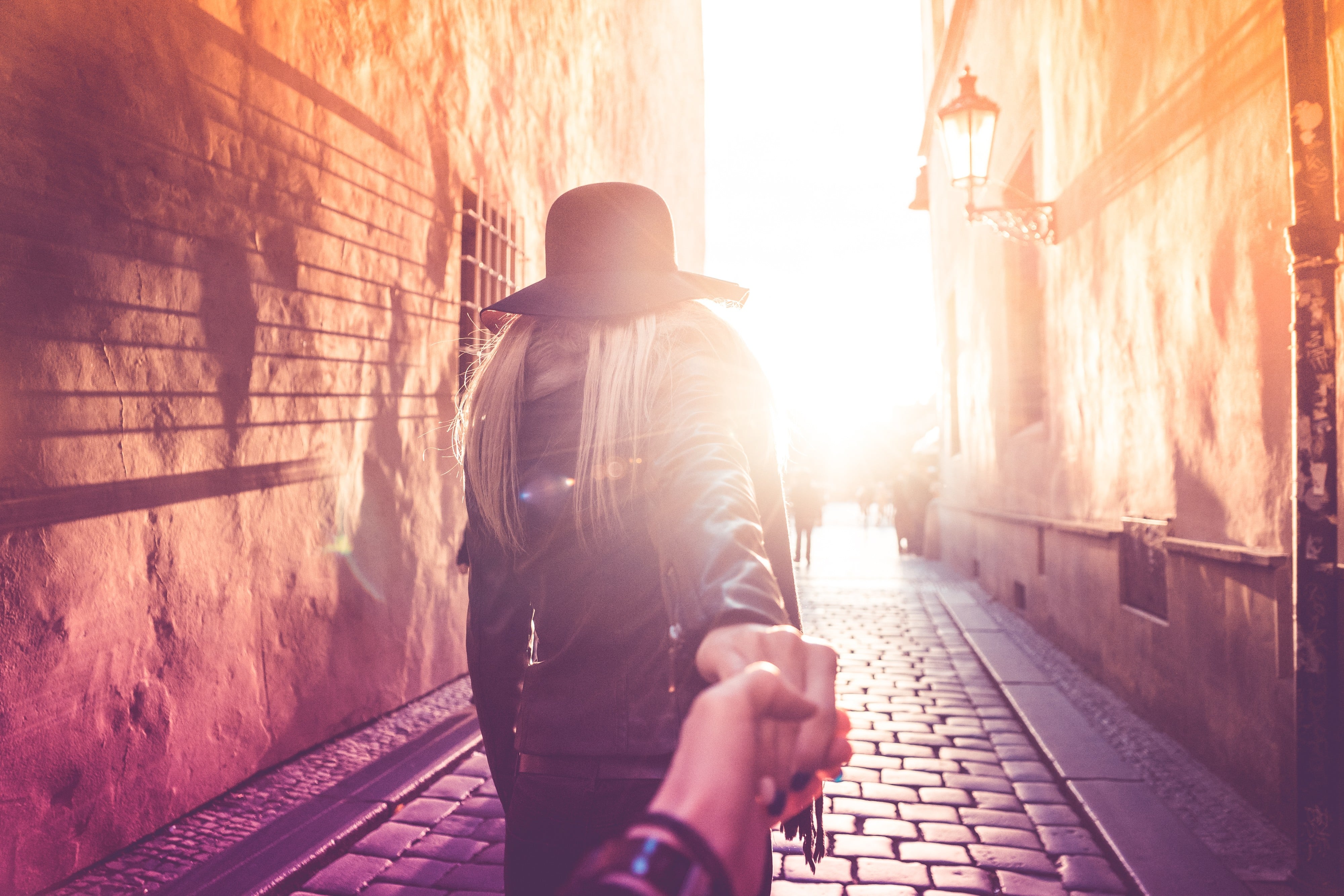 Woman in old city with follow me pose